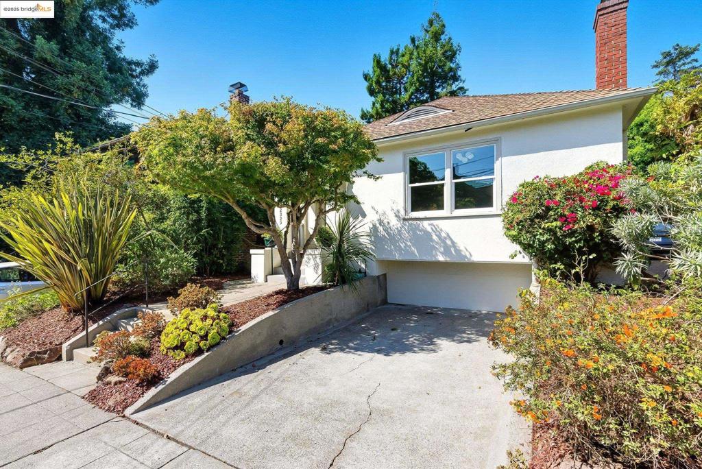 Discover this classic 1922 Berkeley bungalow in the highly sought-after Lower Elmwood neighborhood. This inviting two-bedroom, one-bath home offers approximately 1,164 sq ft of living space on a generous 4,725 sq ft lot, blending timeless Craftsman charm with thoughtful modern updates. The spacious living room features refinished hardwood floors, a wood-burning fireplace, and built-in bookcases, while the formal dining room provides an ideal setting for entertaining. The bright kitchen includes a cozy breakfast nook and new luxury vinyl flooring, complementing a recently remodeled bathroom. Upgrades throughout the home include new electrical sockets, refreshed landscaping, and a revitalized natural pond in the backyard. The detached rear cottage provides flexible space for a studio, guest retreat, or home office. The expansive backyard is a private oasis with fruit trees, meandering garden paths, and a large deck perfect for gatherings under the string lights or quiet evenings outdoors. Conveniently located just blocks from UC Berkeley, BART, Berkeley Bowl, and popular cafes and shops, this home offers a rare combination of character, versatility, and walkability in one of Berkeley’s most desirable locations.