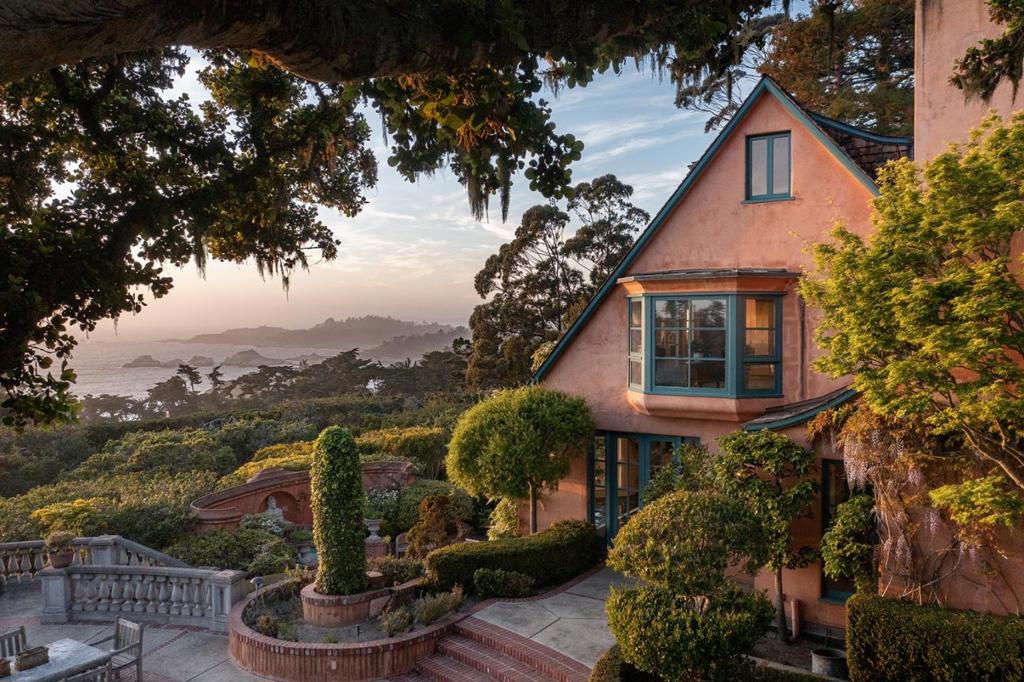 Offered for the first time in nearly 50 years, this extraordinary Carmel Highlands estate is a rare, once-in-a-generation opportunity for the ultimate in coastal privacy and convenience. Perched above the pristine Spindrift coast, it boasts sweeping, unobstructed whitewater views of Point Lobos, Yankee Point, and the endless Pacific beyond. The orientation of the house enables views of the sun dropping into the ocean every night of the year. The architectural soul of the home has remained intact, with major renovations executed so seamlessly that they feel original. Spanning four levels, the main house features sophisticated finishes, a sauna, steam shower, theater, and expansive terraces and balconies overlooking lush grounds. Hand-carved limestone fireplaces sourced from Arroyo Seco with French-style laid brick lend warmth and timeless character in the library and living room. The lot is almost ~2 flat, usable acres with mature landscaping, tranquil fountains, and a rare natural spring. A detached, 2-bay garage and private guest studio offers flexibility for hosting or options for on-property caretaking. Studded with redwoods and screened by mature hedges, the property offers serenity, security, and the ultimate in coastal privacy. This is not just another house, it's a legacy.