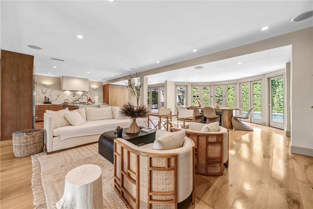 Nestled in a coveted cul-de-sac south of the boulevard in Encino’s prestigious Lanai School District, 4060 Harclare Lane is the epitome of luxury California living. Reimagined top-to-bottom in a custom 2023 renovation, this single-story home masterfully blends artisanal craftsmanship with modern elegance—offering a truly turnkey experience.
Step beyond the freshly manicured hedges and palm-lined approach into a bright, sophisticated interior where no detail has been overlooked. The home features custom hand-made wood flooring, Venetian plaster accent walls, and natural light flooding every room, creating an inviting warmth and cohesive design flow.
The chef’s kitchen is a showstopper: outfitted with custom wood cabinetry, a large center island, and high-end appliances by Wolf, Sub-Zero, and Cove. The open-concept layout seamlessly connects the kitchen to the expansive living and dining areas. Entertain in style with a built-in bar, custom cabinetry, and concealed wood sliding TV doors—all thoughtfully integrated to elevate both aesthetics and function.
Retreat to a serene primary suite featuring a bay window vanity nook, a walk-in closet with custom display cabinetry, and a resort-level bathroom with double iron and glass doors, a floating vanity, soaking tub, and a Venetian plaster-finished double shower. Each additional bedroom is equally refined, with updated closets, custom storage solutions, and beautifully renovated en-suite or guest baths.
An expanded guest house offers even more flexibility—perfect as a studio, home office, or private quarters—with its own kitchen and bathroom.
The outdoor space rivals any five-star resort. Entertain year-round in a fully equipped custom outdoor kitchen complete with:
Built-in grill,
Fire pit countertop,
Refrigerator/freezer,
Warming drawer,
Power burner,
Sink,
Wall-mounted TV, and
Ceiling fan.
The sparkling pool features a new retractable cover, and lush landscaping surrounds every inch of this sanctuary. Eco-conscious upgrades include a Tesla Powerwall, solar panels, and a new roof on both the main house and guest house.
Tesla charger,
Surround sound system - indoor and outdoor,
Finished garage,
Smart home integration.
Buyer and buyer’s agent to independently verify all information and satisfy themselves regarding the property’s features and square footage. Main house and garage: 3 bed / 3 bath, approx. 2,846 sq ft. Guest house: 1 bed / 1 bath, approx. 485 sq ft.