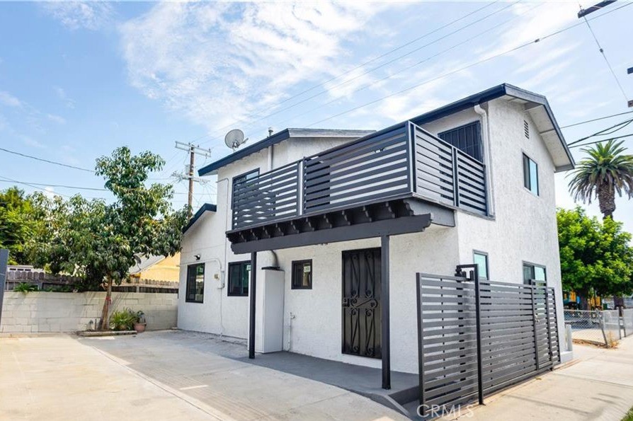 This is a highly upgraded 3-bedroom single family home. Recently reimagined interior to include 3 bedrooms, 2 upstairs and 1 down. Downstairs are the living room, dining room, kitchen, bedroom, bathroom, and an inside laundry room, all with new finishes including Wood styled LVP flooring two tone paint, tall base boards. Kitchen has all new Stainless appliances, shaker style white cabinets with quartz counters, full tiled backsplash, and designer hardware. Upstairs are two spacious bedrooms and a wonderful bathroom. Both bedrooms enjoy a large balcony, perfect for enjoying the evening sunset. Both bathrooms feature a large shower with glass shower door, new vanity, sink faucet, toilet and a lighted mirror. Bright recessed lighting in all room. Upgraded with Central heating for your comfort. Private gated courtyard perfect for 2 car parking. Close to USC campus, exciting dining opportunities, and a vibrant Los Angeles community.