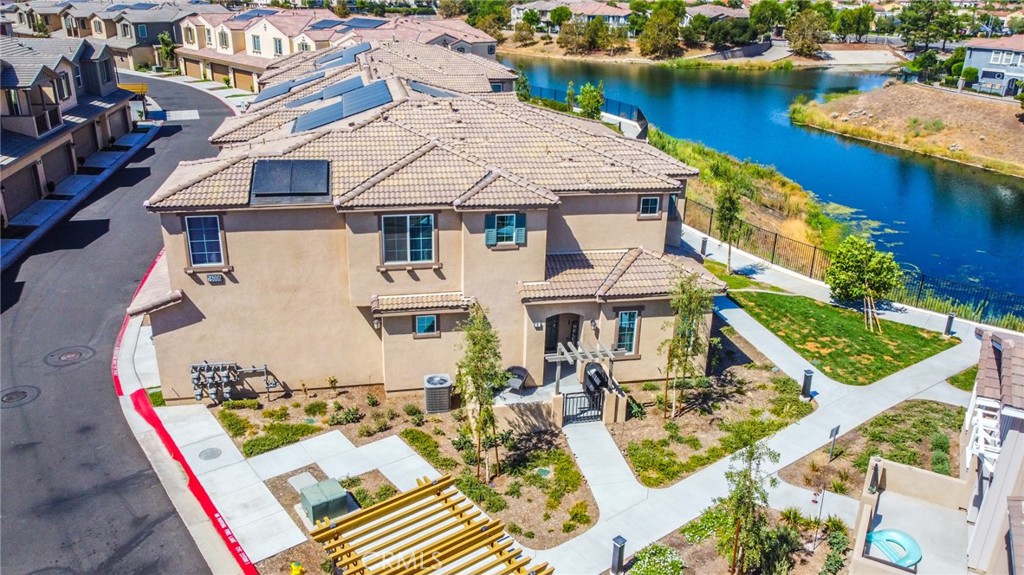 Discover the perfect blend of comfort, style, and convenience in this stunning corner-unit condo located in the highly desirable gated community of Aspen Hills. With over 2,100 sq. ft. of living space, this 4-bedroom, 3.5-bath home (one bedroom currently set up as an office) offers room for everyone.
Step inside to find a bright, open layout featuring a modern kitchen with a large island peninsula, perfect for cooking and entertaining. The upstairs private primary suite boasts serene lake views, a walk-in closet, and a spacious en-suite bathroom.
Enjoy your morning coffee or evening sunsets from your private front patio overlooking the lake. The community itself offers resort-style amenities including a sparkling pool and spa, all within a secure gated setting.
With solar panels for energy efficiency, corner-unit privacy, breathtaking views, and a location just minutes from shopping, dining, and medical care, this home offers the very best in lakefront living in Moreno Valley.
