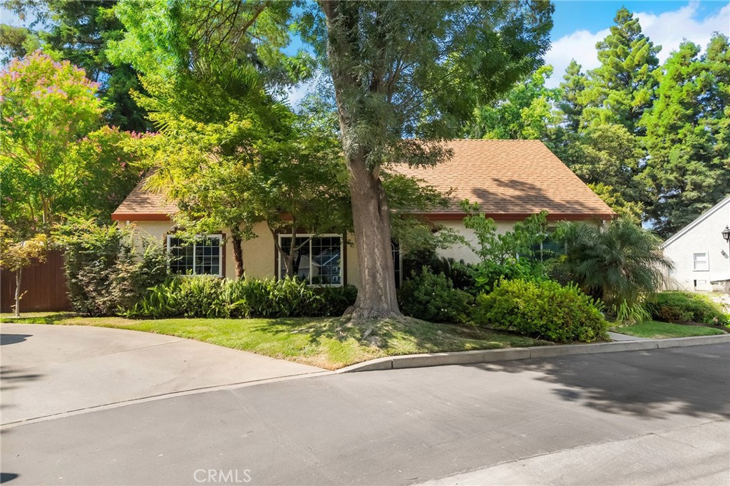 Tucked away in the quiet and welcoming Henshaw Manor neighborhood, this beautifully maintained 3-bedroom, 2-bathroom home offers a great floor plan, incredible outdoor space, and thoughtful updates throughout. Located on a cul-de-sac, it’s surrounded by lush, green landscaping that showcases the care of the previous owner—a master gardener. Step inside to find tall ceilings, a spacious living room with a cozy fireplace, and a large open kitchen with a generous dining area—ideal for gatherings or quiet nights in. The primary suite is conveniently located on the lower level and features an en-suite bathroom with a separate shower and bathtub, plenty of closet space, and private slider access to the serene backyard. Upstairs, you'll find two guest bedrooms and a full bathroom, offering a perfect layout for privacy and flexibility. The backyard is a true oasis, with green grass, colorful flowers, mature plants, and ferns creating a peaceful, garden-like retreat. Additional features include an indoor laundry room, a 2-car garage, and recent updates such as a newer roof (2021), HVAC unit (2023), dual-pane windows and sliders (2024), carpet (2025), and garage door opener (2025). Located on the north side of Chico, just minutes from shopping, restaurants, and more—this is a home you won’t want to miss!