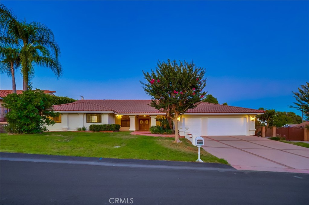 Elegant Single-level custom home with timeless appeal, located on a quiet cul-de-sac in one of Walnut's most prestigious neighborhoods. This home offers exceptional comfort, style, and space. A Spacious covered front porch welcomes you to a grand double-door entry and a dramatic foyer with vaulted wood-beam ceilings that add warmth and architectural character to the spacious living areas. The home features a formal dining room, Private home office, sparking chandelier, wet bar, and a stone archway with fireplace and built-in cabinetry. The gourmet kitchen offers an ideal settings for both entertaining and everyday living. Oversized windows and sliding glass doors fill the interior with natural light and open to a professionally lanscaped backyard featuring patio, river-rock pool, spa and basketball court.
Conveniently located within walking distance to Suzanne Middle School and Walnut High School within the award-winning Walnut Valley Unified School District.
