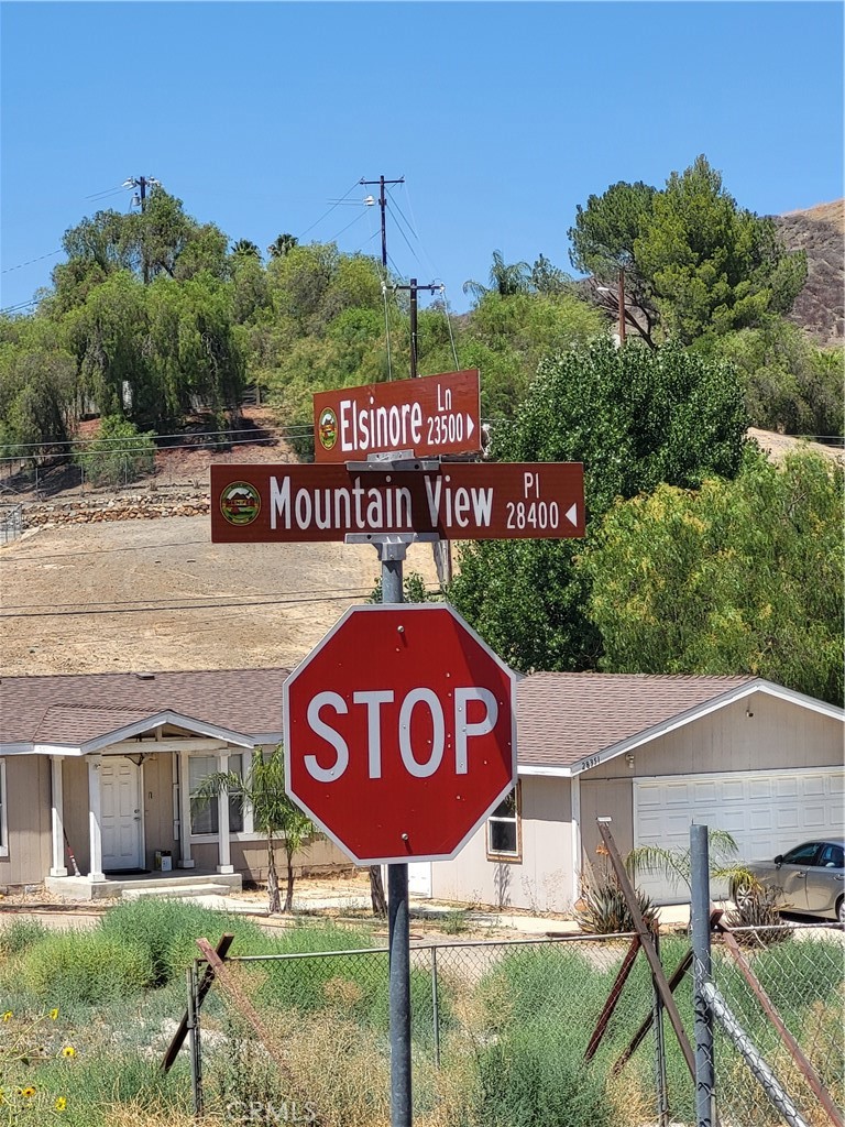 Flat lot between 2 houses; Across from 23543 Elsinore Ln. Great for owner/investor future use. Check with the city for planning.