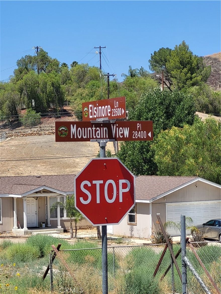 Flat lot between 2 houses; Across from 23543 Elsinore Ln. Great for owner/investor future use. Check with the city for planning.