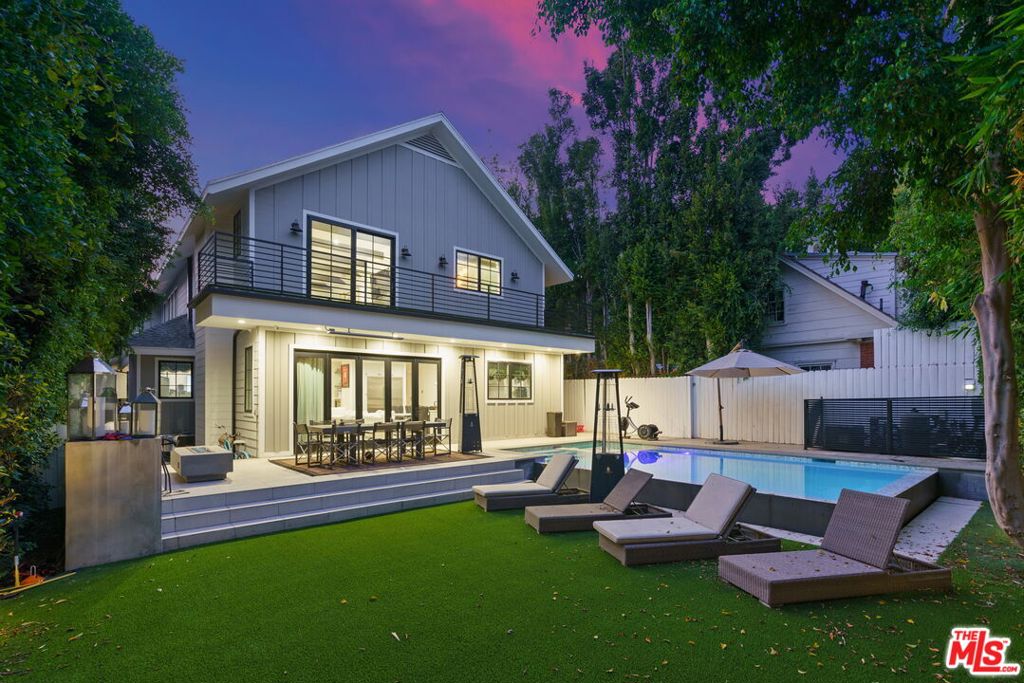 Beautifully Renovated 5-Bedroom Home in Lower Nichols Canyon! This 2-Story Modern Farmhouse Stunner features the best of designer finishes throughout & is the epitome of indoor/outdoor living at its finest. First floor features a modern open-concept layout w/ oversized windows & lots of natural light throughout. Formal living room area w/ chandelier. Dining area w/ boxed-in ceiling. Bar area w/ wine cooler. Chef's kitchen w/ custom cabinetry, high-end Wolf appliances, & dine-in bar/center island. Adjacent family room w/ fireplace & folding patio doors leading to stunning backyard area. Resort-style entertainer's backyard featuring an infinity pool/spa, dining area w/ radiant heater, outdoor kitchen/BBQ area, fire pit w/ seating, & grassy area. Spacious Master Bedroom Retreat w/ exposed wood-beam ceilings, fireplace, dual walk-in closets, soaking tub, & huge balcony overlooking the backyard. Fully paid-off solar system. Fully gated & private lot. Circular driveway w/ 5 car parking. Centrally located & just minutes to the best shopping, dining, & entertainment the area has to offer. A truly unique opportunity that is not to be missed!