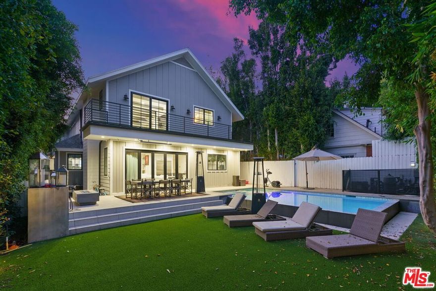 Beautifully Renovated 5-Bedroom Home in Lower Nichols Canyon! This 2-Story Modern Farmhouse Stunner features the best of designer finishes throughout & is the epitome of indoor/outdoor living at its finest. First floor features a modern open-concept layout w/ oversized windows & lots of natural light throughout. Formal living room area w/ chandelier. Dining area w/ boxed-in ceiling. Bar area w/ wine cooler. Chef's kitchen w/ custom cabinetry, high-end Wolf appliances, & dine-in bar/center island. Adjacent family room w/ fireplace & folding patio doors leading to stunning backyard area. Resort-style entertainer's backyard featuring an infinity pool/spa, dining area w/ radiant heater, outdoor kitchen/BBQ area, fire pit w/ seating, & grassy area. Spacious Master Bedroom Retreat w/ exposed wood-beam ceilings, fireplace, dual walk-in closets, soaking tub, & huge balcony overlooking the backyard. Fully paid-off solar system. Fully gated & private lot. Circular driveway w/ 5 car parking. Centrally located & just minutes to the best shopping, dining, & entertainment the area has to offer. A truly unique opportunity that is not to be missed!