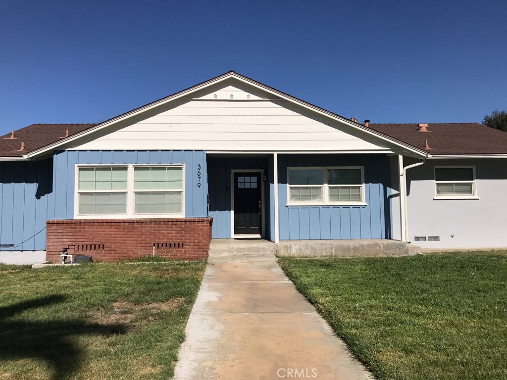 Discover this charming home in a central Riverside location offering quick and convenient access to the 91 freeway. Fresh exterior paint and inviting curb appeal set the tone as you step inside. The large living room boasts a designer tile fireplace, abundant natural light, and laminate wood floors that flow throughout the main areas.