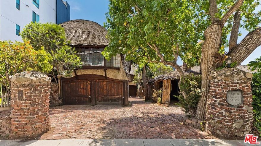 Remarkably rare opportunity to live in a landmark example of Storybook architecture in the middle of the most vibrant part of Culver City. The Hobbit House Apartments are a designated historic cultural monument in the city of Los Angeles and rarely have a vacancy out of their 9 units. From the moment you enter the double-lot property, you are transported into another world which could have readily existed in 18th century Europe or in an exhilarating lucid dream. Approached beside a large "living" water-feature pond, this independent detached "house" served as the primary residence for the creators of the property and features an open flow entertaining plan with a Great room design and intricate hand-carved wood flooring. The endless whimsical details include nautically themed custom woodwork, stained glass, carved wood paneling, and built-ins throughout. The main bedroom displays a built-in bench and unique storage cabinets/drawers. The green-tiled bath is a wonder to behold. Lovely quaint kitchen with period stove is surrounded by a circular bar for dining or gatherings. Separate large den with outdoor entry, vaulted beamed ceiling, and new sisal carpeting. Certain furniture built for the home will be included. Extra storage area outside. Moments to the heart of Culver City, tech campuses, transportation, dining, and entertainment all buoyed with an incredibly high WalkScore. The Hobbit House is now available for a long-term lease to a highly qualified pre-screened tenant.