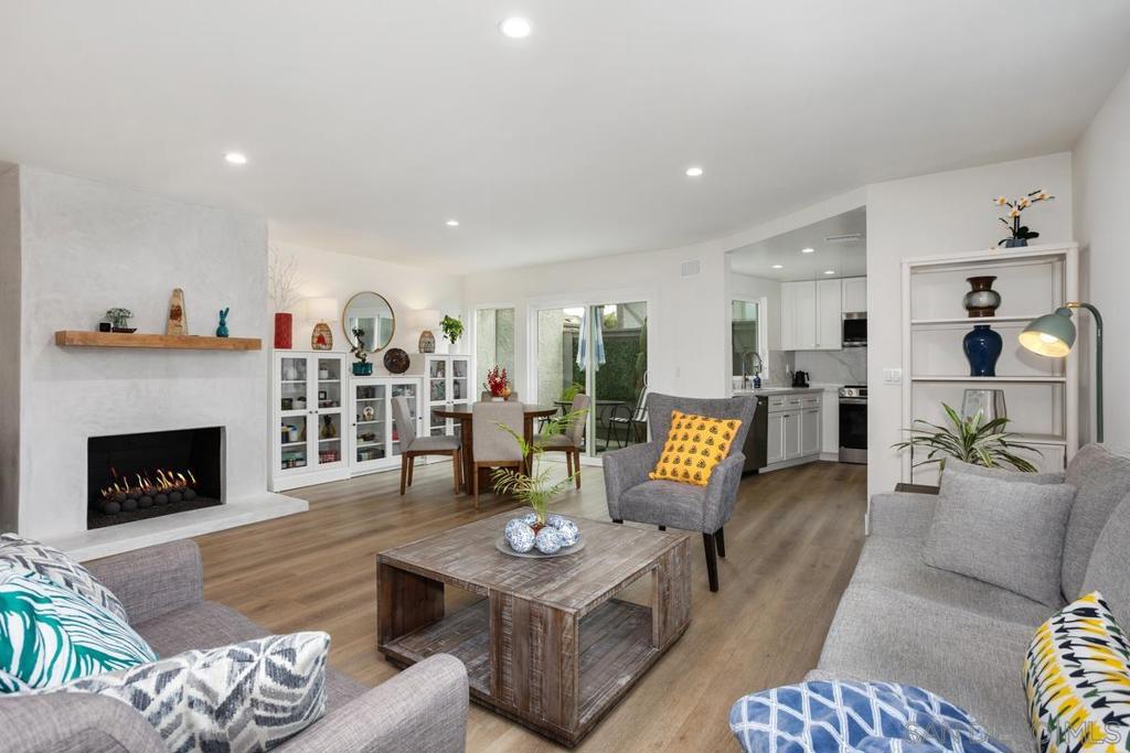 Pride of ownership! Stunning contemporary end unit townhome in La Costa, only attached to 1 other unit! Home was remodeled in 2024. Spacious open floor plan! Gorgeous kitchen boasts: quartz countertops, white cabinetry w/stylish gold hardware, & SS appliances. Expansive living/dining room perfect for entertaining features an elegantly modern fireplace and lovely private patio. Oversized primary BR w/walk-in closet & balcony overlooking the community pool. Luxurious primary BA w/quartz counters, freestanding tub, & chic modern shower. Newer windows! A/C! Attached 2 car garage. Lots of upgrades throughout! Easy access to shopping & restaurants!