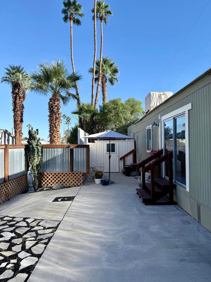 Welcome to Horizon Village Mobile Home Park! This lovely 2-bedroom home features a spacious, fenced patio of about 150 feet--ideal for outdoor dining, relaxing, or giving pets room to play. Enjoy easy desert landscaping, a private 2-car carport, and the convenience of an in-unit washer and dryer. Additional highlights include two 10x10 storage units, a mini-split system, two window A/C units, and a swamp cooler for year-round comfort.Horizon Village offers a prime location near the Bob Hope Estate and Araby hiking trails, with Starbucks, Trader Joe's, and Target just minutes away. Downtown Palm Springs is only a 7-minute drive, and Palm Springs International Airport is just 3 miles from home. Residents enjoy resort-style amenities, including a heated pool and spa, clubhouse, fitness room, library, shuffleboard, dog park, and more.