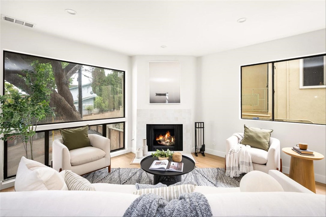 Experience easy coastal living in this beautifully updated 2-bedroom, 2.5-bath condo nestled in the heart of North Redondo Beach. Offering 1,218 sq ft of bright, thoughtfully designed space, the main level welcomes you with an open living area featuring a cozy fireplace, new flooring, and oversized windows that fill the home with natural light. The sleek kitchen boasts stainless steel appliances, stylish countertops, and refreshed cabinetry that blend form and function. A convenient half bath on the main level adds comfort for guests. Upstairs, two spacious bedrooms include a serene primary suite with a private balcony and ensuite bath. Enjoy entertaining or relaxing on the private rooftop patio with sweeping views. This home also comes with its own private 2-car garage, providing secure parking and extra storage. Close to top-rated schools, beaches, shopping, and dining, this is a South Bay opportunity you won’t want to miss. The seller is willing to explore creative options to help make ownership possible - ask for details.