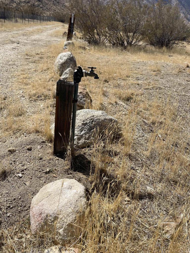 WATER ALREADY ON THE PROPERTY!! This 1.09 acres in Shelter Valley. Property has a gated entry and is partially fenced and on all level land. Water line already on the property, there is a recorded shared well agreement. Electric at the property line. Desert & Mountain Views! Great for living off the grid.