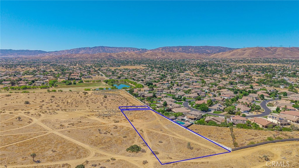 Incredible view property adjacent to the prestigious Portofino Estates in Quartz Hill! This 2+ acre parcel offers stunning panoramic views and endless potential. The lot slopes from north to south. Quartz Hill water tanks are to the east. This is a rare opportunity to secure a prime view lot adjacent to a sought-after neighborhood as the area continues to grow and develop. Imagine the possibilities—then come build your dream house with breathtaking views all around. Quartz Hill offers schools, parks, shopping, and easy access to Palmdale and Lancaster, with the Angeles National Forest just a short drive away. Build your dream home or invest in future growth while enjoying both convenience and natural beauty. Don't wait—this is one of those properties you buy today and thank yourself for tomorrow. Note: Outlines shown on photos are ESTIMATES ONLY and do not represent exact property boundaries. Buyer to verify all property lines and availability of all utilities.