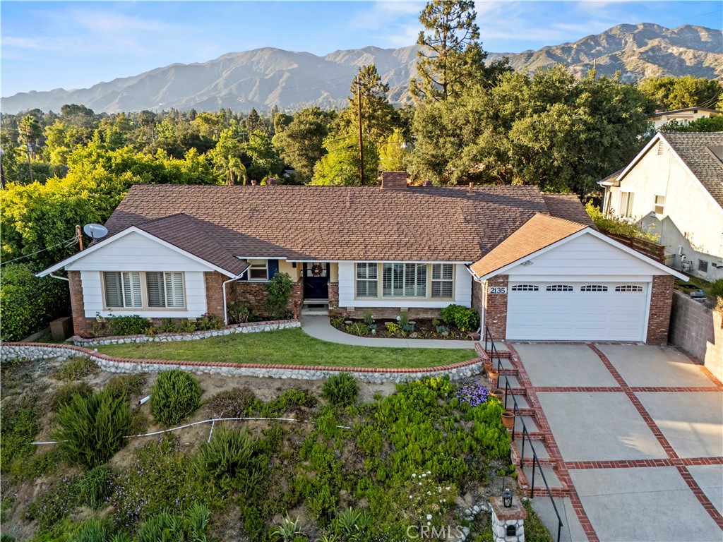 This single-story La Cañada Flintridge home blends timeless character with modern updates and incredible flexibility. Featuring 3 oversized bedrooms, 3 full bathrooms, and a large permitted bonus room just off the kitchen that could easily serve as a 4th bedroom, home office, or second family room—this layout offers room to grow. Charming tongue-and-groove ceilings, two gas-burning fireplaces, crown molding, newer windows, and a bright, welcoming family room set the tone from the moment you walk in.
The remodeled kitchen features newer appliances and flows into a spacious bonus room with its own full bath, ideal for entertaining, relaxing, or creating the space you've always wanted. The primary suite is a true retreat with a cozy window seat, large closet, plantation shutters, and a remodeled ensuite bathroom. Both guest bedrooms are generous in size and share a full bath with vintage charm.
Freshly painted inside in July 2025 and recently updated on the exterior, this home has been impeccably maintained by its previous owner—and it shows. Spotless and full of warmth, it’s the kind of property that invites you to remodel with intention—updating what you want while preserving the original character that makes it so special.
A long driveway, attached garage, and a massive private backyard with stunning mountain views offer endless potential. Whether you're dreaming of a pool, outdoor entertaining space, or garden, the setting is picture perfect.
Located in one of the most desirable neighborhoods in La Cañada Flintridge, known for its award-winning schools, Descanso Gardens, scenic trails, and vibrant local dining and shopping. Homes like this don’t come up often. Clean, classic, and full of opportunity—this one’s ready and waiting for you.