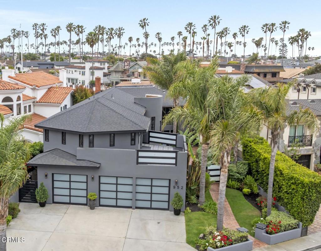 Prime Ventura Keys Waterfront Retreat - Modern Elegance with Dock & Wine CellarExperience the best of coastal living in this beautifully remodeled Ventura Keys waterfront home. Featuring a newer 38-ft boat dock and an Electric Craft 18-ft pontoon boat, this home offers direct access to the serene canals.A custom water fountain entry sets a sophisticated tone, leading into a flexible layout with 4 bedrooms, a home theater, and a covered patio that can be enclosed as a 5th bedroom or office. The open-concept interior showcases a gourmet granite island kitchen, spacious dining area, and a welcoming living room with fireplace.A true highlight is the temperature-controlled 1,800-bottle wine cellar, perfect for collectors and entertainers. The main level includes a guest bedroom and full bath, ideal for guests or multi-generational living.Upstairs, the expansive primary suite offers stunning channel views, a walk-in closet, and a spa-inspired bath with soaking tub. Enjoy multiple newly tiled decks, including a grand main deck for al fresco dining, grilling, and relaxing by the built-in firepit.Additional features include a 3-car garage, high-end finishes, and a prime location in one of Ventura's most desirable waterfront communities. This turn-key retreat blends luxury, flexibility, and coastal charm.
