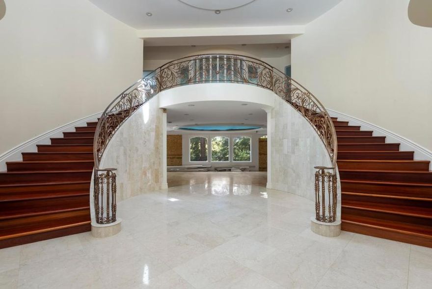 SKY VILLA: RE-IMAGINE ROYALTY IN THE WOODS. Sky Villa is an opportunity to DREAM BIG with unmatched grandeur & privacy. An Italian Renaissance mansion engineered to commercial standards, but now awaiting your completion. Easy ingress/egress off Hwy 92 and Skyline presents this estate in sequestered privacy. A long driveway descends to the motor court & the Villa's monumental architectural scale. A 2-Story Lobby with Imperial Staircase is the powerful opening salvo. 4 levels of destinations inspire your finishing details: a Library off of the lobby, Two Enormous Primary Suites on the two main levels, multiple Offices, immense walk-in closets, & unfinished lower levels of Rec Room, Wine Vault, Grand Loggia, & dreamy Mezzanine facing majestic Sequoia Forest. Flat rear grounds inspire a pool & ADU. Off-street parking for the most grand events, plus 2 separate attached garages: a daily 3-car at the motor court, plus a lower level 2-car attached garage. Long the bastion for Silicon Valley founders and CEO's, Woodside blurs the line between timeless province and epicenter of wealth and innovation. With SKY VILLA, you will take the lead as your own pioneer, a developer of a nearly complete architectural masterwork, ready to take flight in one of California's most prestigious communities.