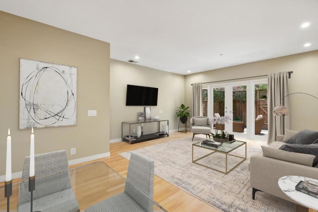 A rare opportunity to own a private, modern townhome-style condominium in Santa Clara! This beautifully updated home offers the privacy of having no neighbors above or below, paired with the comfort of a townhome-style residence. The first level features a spacious living room, dining area and gourmet kitchen showcasing granite countertops, stainless steel appliances and temperature-controlled wine storage. Hardwood flooring in the main living areas, plantation shutters, recessed lighting and two-zone heating and A/C ensure year-round comfort. Upstairs, two primary bedrooms provide excellent closet space and two spacious bathrooms feature modern slate, tile, and European-style beech wood cabinetry. An in-unit laundry area is conveniently located on this level. Relax in your private backyard patio - perfect for entertaining - or take advantage of the HOAs beautifully landscaped gardens, pool/spa, gym and outdoor kitchen barbecue. The unit includes two reserved parking spaces (one garage parking space and one assigned space) plus additional storage. Close to major tech employers including Cisco, Apple, and Nvidia, as well as Santa Clara University, Santana Row, and Valley Fair. Conveniently located just minutes from Highways 101 and 880, and San Jose International Airport.