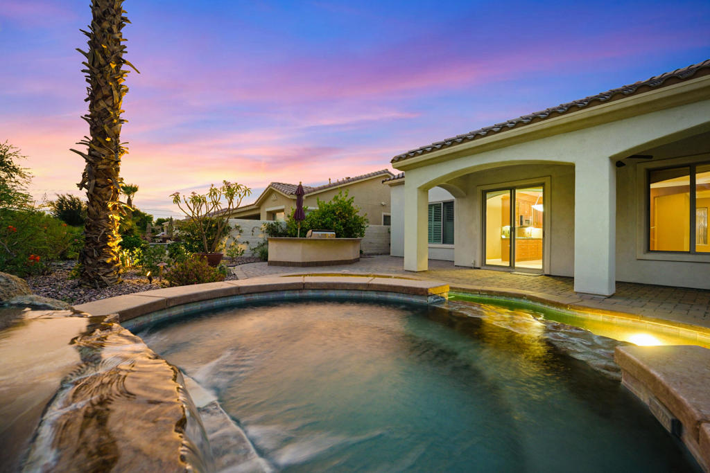 Welcome to this San Rafael floor plan located in the premier 55+ active adult community of Sun City Shadow Hills. This beautifully maintained 3 bedroom, 2.5 bath home offers 2,376 SqFt (EST.) of comfortable desert living and is perfectly positioned on the golf course with sweeping southern fairway views. Inside, you'll find an open-concept layout with a spacious great room, built-in media center, cozy gas fireplace, and large windows that bring in tons of natural light. The chef's kitchen boasts granite countertops, stainless steel appliances, and a central island with bar seating. The primary suite features plush carpeting, a ceiling fan, and direct access to the backyard, plus a spa-like ensuite bath with dual vanities, a walk-in shower, soaking tub, and a generous walk-in closet. Step outside to your own private oasis with a covered patio, paver flooring, ceiling fan, and a sparkling pool with a water feature all overlooking the serene golf course. Additional highlights include tile flooring throughout main living areas, plantation shutters, and a dedicated laundry room. Enjoy all the amenities Sun City Shadow Hills has to offer including two clubhouses, pools, tennis and pickleball courts, fitness centers, golf, and more! This home is definitely a must-see!