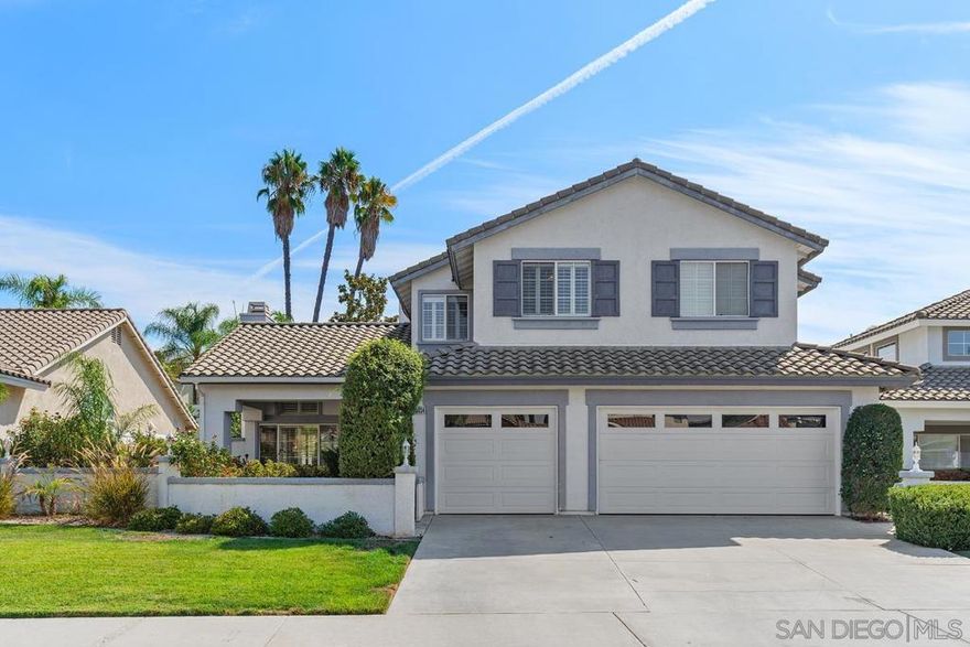 Experience the resort lifestyle in this stunning 2-story pool and spa home, tucked behind a private courtyard entry. With 5 bedrooms, 3 baths, and a 3-stall garage on a spacious 1/4 acre lot, this home offers the perfect blend of luxury and comfort. Step through the double entry doors onto a tiled foyer and take in the elegant wooden staircase and banister. The recently updated kitchen boasts white, glass-faced cabinets, stainless appliances, subway tile backsplash, walk-in pantry, and a Quartz island ideal for culinary creations. A convenient bedroom with a full bath is located on the main floor, while upstairs you’ll find two teen suites with their own private retreats, plus an additional bedroom. The expansive primary suite features a cozy fireplace and a large balcony w/breathtaking views of the sparkling pool and spa. The primary bath offers a separate shower, a soaking tub, and a spacious walk-in closet. Plantation shutters throughout add a touch of classic charm. Outside, the crystal-clear pool with a waterfall spa is complemented by an outdoor entertainment space that includes a fireplace, built-in BBQ, and mini fridge. Relax in the shaded seating areas with outdoor ceiling fans, beneath freshly painted patio covers and separate pergola.  New white vinyl fencing surrounds the backyard, ensuring added privacy. New Variable speed pool filtration, EV Charging port, Leased Solar, and so much more w/No HOA. This home is truly a must-see!