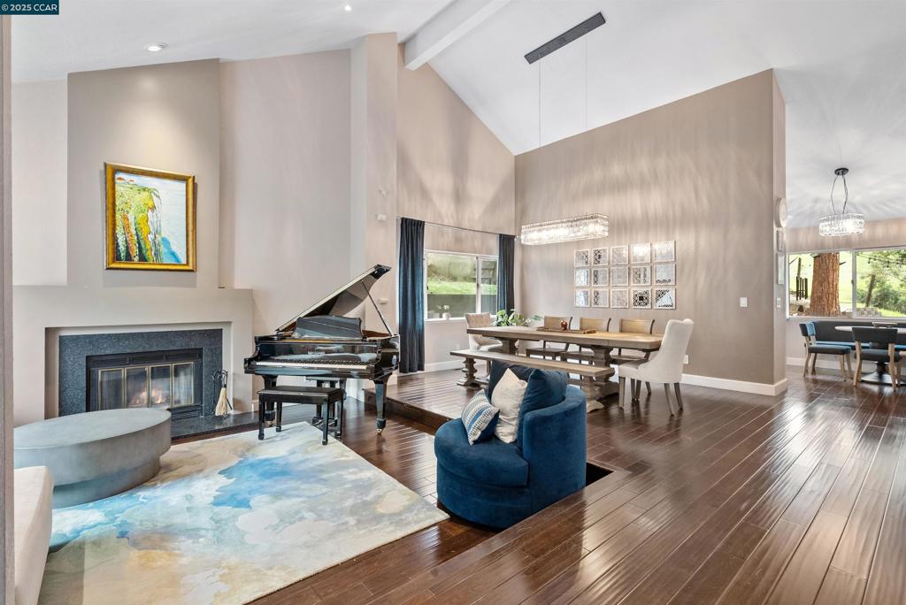 Welcome to this stunning Mediterranean villa-style retreat, perfectly positioned against the Alhambra open space. This rare gem offers the tranquility of country living with the convenience of city life. Inside, a thoughtfully updated interior features a chef-inspired kitchen with breakfast nook, gleaming hardwood floors, newer carpet, recessed lighting, and beautifully updated bathrooms. The spacious ensuite primary bedroom showcases sweeping views, while vaulted ceilings, a grand fireplace, and sun-filled formal living and dining rooms create a warm and elegant atmosphere. A large family room opens to the backyard for seamless indoor-outdoor living. Designed for versatility, the home includes a potential in-law suite, barn door at the lower level, inside laundry, and modern upgrades such as a new 3-zone heating/cooling system and tankless water heater. A custom studio/theater with private entrance provides the ultimate creative escape, while smart-house features add modern appeal. The exterior impresses with updated pavers, patio, and fruit trees, offering charm and function. Surrounded by open space on two sides, the property delivers privacy while remaining close to shops, restaurants, and top-rated schools. In one of the area’s most coveted neighborhoods.