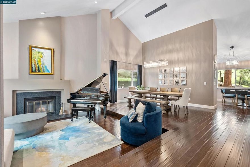 Welcome to this stunning Mediterranean villa-style retreat, perfectly positioned against the Alhambra open space. This rare gem offers the tranquility of country living with the convenience of city life. Inside, a thoughtfully updated interior features a chef-inspired kitchen with breakfast nook, gleaming hardwood floors, newer carpet, recessed lighting, and beautifully updated bathrooms. The spacious ensuite primary bedroom showcases sweeping views, while vaulted ceilings, a grand fireplace, and sun-filled formal living and dining rooms create a warm and elegant atmosphere. A large family room opens to the backyard for seamless indoor-outdoor living.  Designed for versatility, the home includes a potential in-law suite, barn door at the lower level, inside laundry, and modern upgrades such as a new 3-zone heating/cooling system and tankless water heater. A custom studio/theater with private entrance provides the ultimate creative escape, while smart-house features add modern appeal.  The exterior impresses with updated pavers, patio, and fruit trees, offering charm and function. Surrounded by open space on two sides, the property delivers privacy while remaining close to shops, restaurants, and top-rated schools. In one of the area’s most coveted neighborhoods.