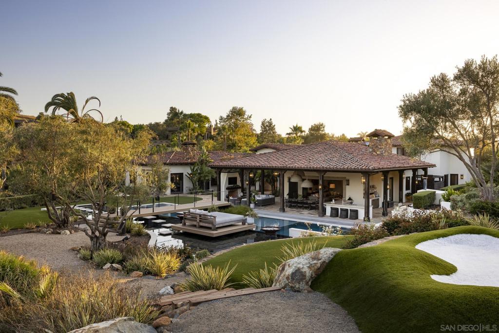 Welcome home to 3350 Wildflower Valley Drive! The current owners spared no expense in their renovations to create the epitome of a family dream home. Located in the highly-sought after Wildflower Estates guard-gated equestrian community, and tucked at the end of a cul-de-sac, the estate boasts utmost privacy and convenience. Upon arrival, one is greeted by an impressive Spanish-style entry courtyard which leads to both the main residence and the separate entertainer’s suite complete with a gym, full bar, golf simulator and guest bath. Inside, the single-level main house features 5 bedrooms plus dual offices, gourmet chef’s kitchen with a walk-in refrigerator and top of the line appliances, impressive great room with bi-fold doors opening to the stunning grounds, and a superior primary suite with a cozy fireplace, spa-like en-suite bath with dual closets – one concealed as a speakeasy. Outside, you’ll find the playground of your dreams, with fun for all ages! From the covered outdoor living/dining pavilion complete with an outdoor kitchen, pizza oven, and fireplace, to the resort-style pool and spa, soccer field, pickleball court, and putting greens to the vineyards, and wine cave with a charming outdoor sitting area with fireplace. It truly doesn’t get better than this! Welcome home to 3350 Wildflower Valley Drive! The current owners spared no expense in their renovations to create the epitome of a family dream home. Located in the highly-sought after Wildflower Estates guard-gated equestrian community, and tucked at the end of a cul-de-sac, the estate boasts utmost privacy and convenience. Upon arrival, one is greeted by an impressive Spanish-style entry courtyard which leads to both the main residence and the separate entertainer’s suite complete with a gym, full bar, golf simulator and guest bath. Inside, the single-level main house features 5 bedrooms plus dual offices, gourmet chef’s kitchen with a walk-in refrigerator and top of the line appliances, impressive great room with bi-fold doors opening to the stunning grounds, and a superior primary suite with a cozy fireplace, spa-like en-suite bath with dual closets – one concealed as a speakeasy. Outside, you’ll find the playground of your dreams, with fun for all ages! From the covered outdoor living/dining pavilion complete with an outdoor kitchen, pizza oven, and fireplace, to the resort-style pool and spa, soccer field, pickleball court, and putting greens to the vineyards, and wine cave with a charming outdoor sitting area with fireplace. It truly doesn’t get better than this!