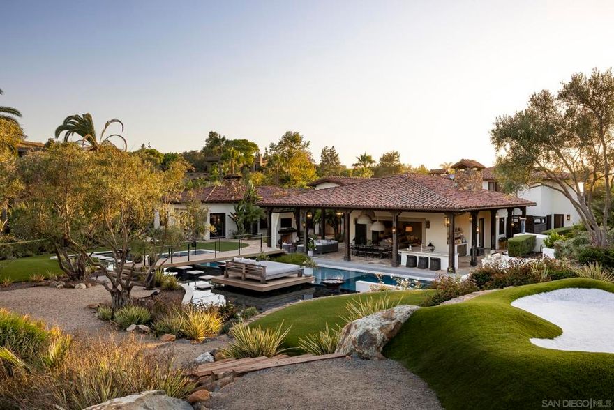 Welcome home to 3350 Wildflower Valley Drive! The current owners spared no expense in their renovations to create the epitome of a family dream home. Located in the highly-sought after Wildflower Estates guard-gated equestrian community, and tucked at the end of a cul-de-sac, the estate boasts utmost privacy and convenience. Upon arrival, one is greeted by an impressive Spanish-style entry courtyard which leads to both the main residence and the separate entertainer’s suite complete with a gym, full bar, golf simulator and guest bath. Inside, the single-level main house features 5 bedrooms plus dual offices, gourmet chef’s kitchen with a walk-in refrigerator and top of the line appliances, impressive great room with bi-fold doors opening to the stunning grounds, and a superior primary suite with a cozy fireplace, spa-like en-suite bath with dual closets – one concealed as a speakeasy. Outside, you’ll find the playground of your dreams, with fun for all ages! From the covered outdoor living/dining pavilion complete with an outdoor kitchen, pizza oven, and fireplace, to the resort-style pool and spa, soccer field, pickleball court, and putting greens to the vineyards, and wine cave with a charming outdoor sitting area with fireplace. It truly doesn’t get better than this!  Welcome home to 3350 Wildflower Valley Drive! The current owners spared no expense in their renovations to create the epitome of a family dream home. Located in the highly-sought after Wildflower Estates guard-gated equestrian community, and tucked at the end of a cul-de-sac, the estate boasts utmost privacy and convenience. Upon arrival, one is greeted by an impressive Spanish-style entry courtyard which leads to both the main residence and the separate entertainer’s suite complete with a gym, full bar, golf simulator and guest bath. Inside, the single-level main house features 5 bedrooms plus dual offices, gourmet chef’s kitchen with a walk-in refrigerator and top of the line appliances, impressive great room with bi-fold doors opening to the stunning grounds, and a superior primary suite with a cozy fireplace, spa-like en-suite bath with dual closets – one concealed as a speakeasy. Outside, you’ll find the playground of your dreams, with fun for all ages! From the covered outdoor living/dining pavilion complete with an outdoor kitchen, pizza oven, and fireplace, to the resort-style pool and spa, soccer field, pickleball court, and putting greens to the vineyards, and wine cave with a charming outdoor sitting area with fireplace. It truly doesn’t get better than this!