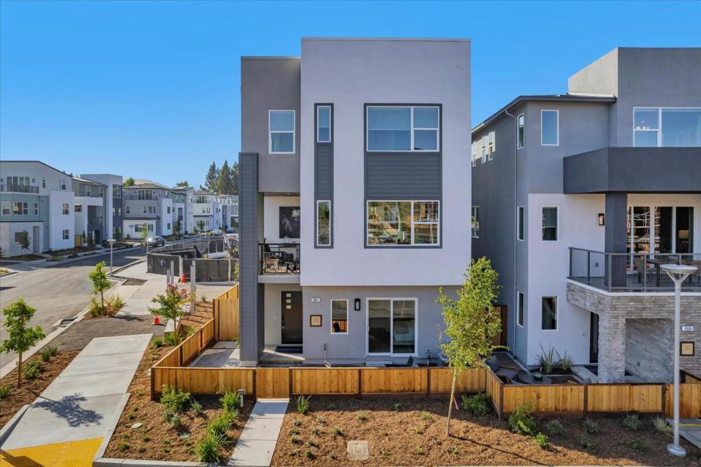 Plan 2 Rows offers 4 bedrooms plus 3.5 bathrooms, featuring a side-by-side garage and a first-floor bedroom perfect for guests. The front entry opens to a charming community park. Its open-concept layout showcases a spacious kitchen with a generous center island, a cozy dining area, and an adjacent office that works as a flexible-use space. A large outdoor deck creates a perfect setting for relaxing or dining al fresco. Interior features include sleek shaker-style paint-grade cabinets and stylish 4" recessed lighting throughout. Solar panels are available through lease or purchase, and theres still time to personalize flooring and countertops. Home is single-family detached, mapped as condominium. City Village, a new neighborhood from award-winning builder SummerHill Homes, includes 404 well-designed homes in San Ramon. Residents benefit from a 2-acre public park, scenic walking and bike trails, serene seating areas, and a shared BBQ zone. Close to City Walk district and just a mile from lively City Center shops, restaurants, Iron Horse Trail, top schools, transit, and employers. Note: Images shown are of model home. Please visit City Village Sales Office to tour.