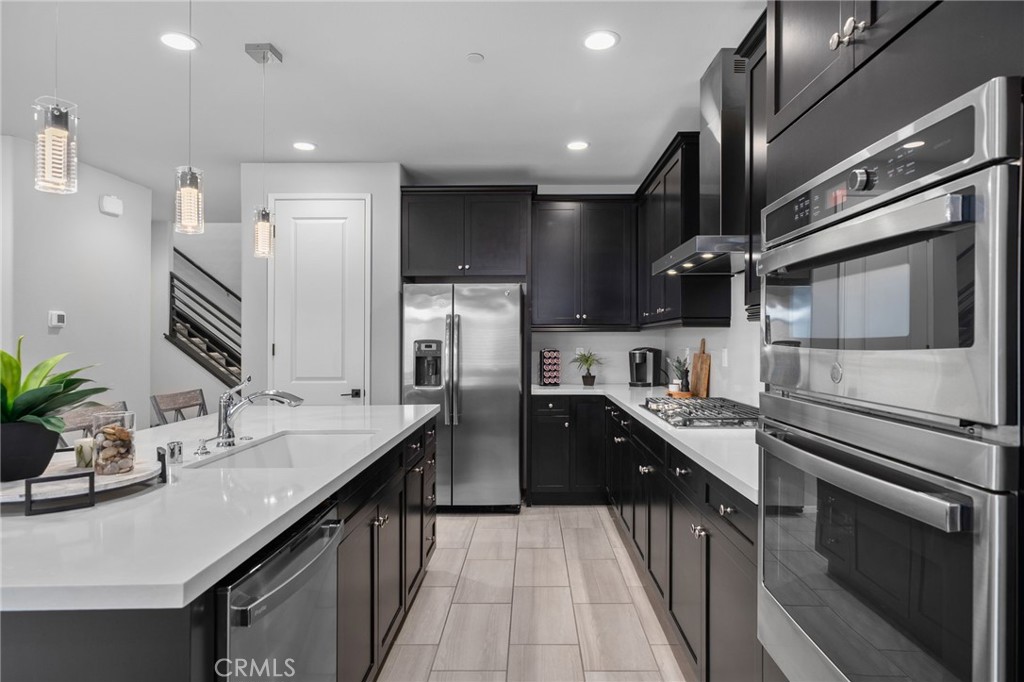 Welcome to Shady Trails — North Fontana’s premier master planned gated community.
This beautifully designed and fully detached condominium offers over 2,200 square feet of living space with 3 bedrooms plus a generous loft, 3 bathrooms, and a two-car attached garage. The open floor plan, finished with full tile flooring on the main level, seamlessly connects the dining area, spacious living room, and a stunning kitchen with an oversized working island with breakfast bar seating, stainless steel appliances, large pantry, and single basin stainless sink. The powder room and primary ensuite are enhanced with upgraded wood and tile plank wall features. You’ll also find expansive under-stairs storage and generous linen space upstairs.
The spacious primary suite features a dual-sink vanity, large soaking tub, walk-in shower, and an oversized walk-in closet. Two additional bedrooms, a shared hall bath with dual-sink vanity, a generous loft, and an upper-level laundry room with custom built-in workstation and storage complete the layout. Plantation shutters are found throughout, and comfort is enhanced by dual-zoned heating and air. A solar lease will be assumed by the buyer.
Living in Shady Trails means enjoying resort-style amenities — including multiple pools and spas, fully equipped fitness centers, pickleball, tennis, and basketball courts, a putting green, the 15,000 sq ft Parkhouse clubhouse with movie theater, game room, business center, playgrounds, and scenic pathways. Plus, you’re just minutes from Victoria Gardens shopping, dining, top-rated schools, and have easy access to major freeways for commuting or weekend getaways.