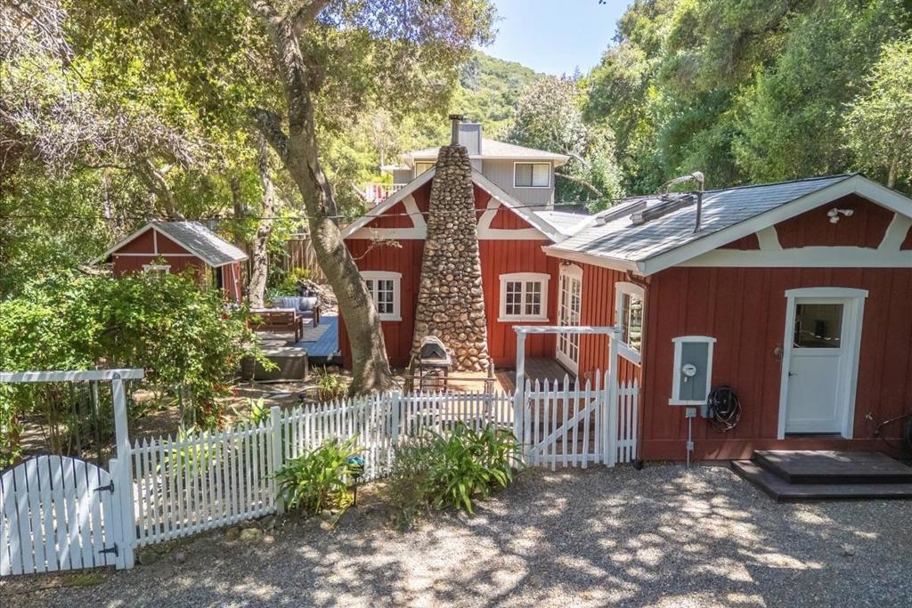 Welcome to an idyllic balance of natural beauty, character, and convenience. Located just a few blocks from Carmel Valley Village and tucked away in a picturesque setting, this single level 2 bedroom and 2 bathroom home encapsulates the countless joys of country living. Whether its the simplicity of gardening among the majestic oaks while listening to the nearby seasonal creek or relaxing with a book by the wood stove fireplace in the vaulted redwood ceiling living room, this property offers a variety of exciting activities both indoors and out. Additional features include an updated kitchen with exposed beams and copper farmhouse sink, stunning interior natural light, multiple exterior entertainment areas, and EV charging station. Easy access to Garland Ranch Regional Park and Carmel River, situated in the desirable Carmel Unified School District, and surrounded by award-winning locally owned businesses. This is a special community and this well loved home awaits its next chapter.