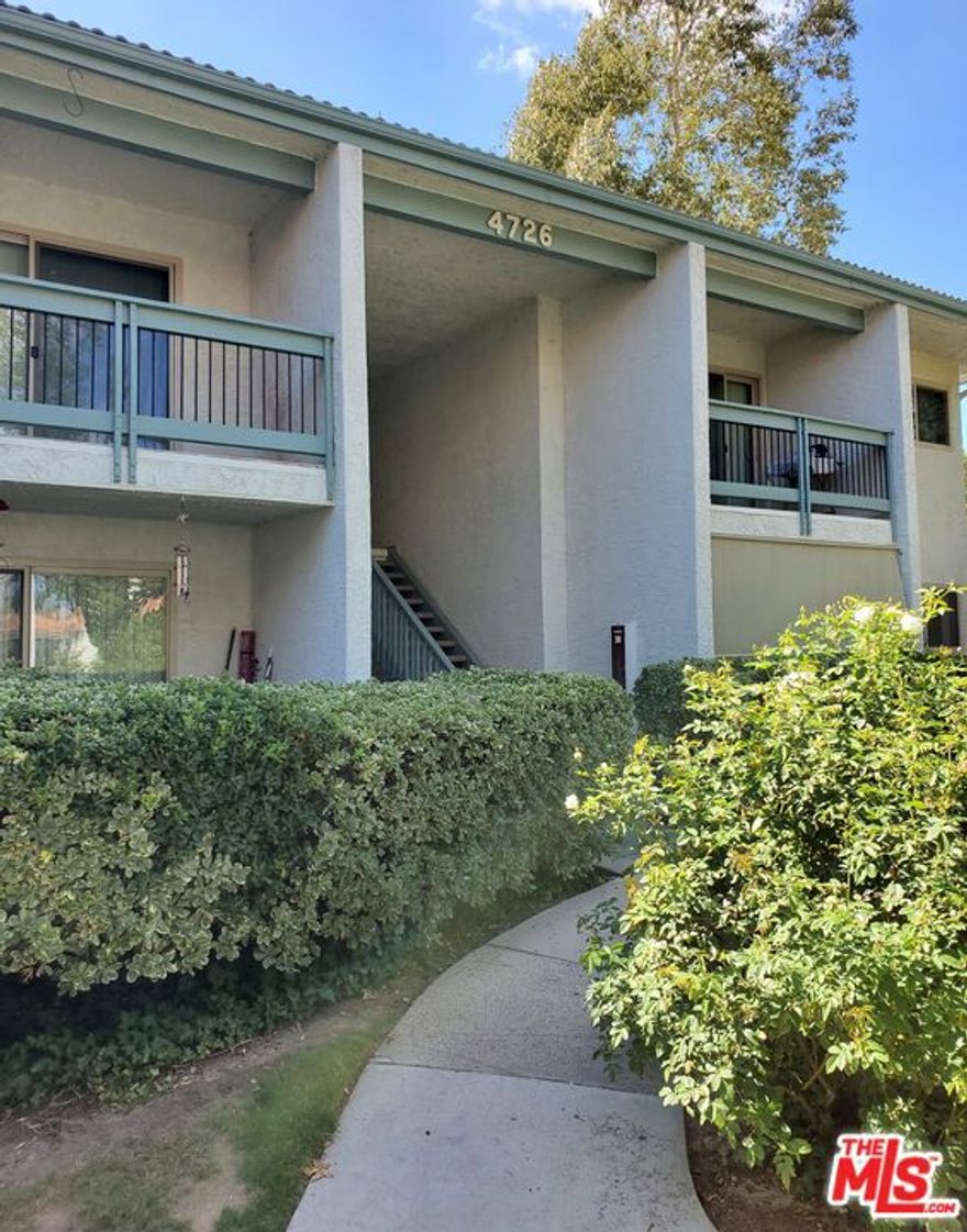 This beautifully maintained upstairs unit offers 1,006 sq. ft. of comfortable living space in the highly sought-after Oak Park Condominium Community, located just off Park Granada. The residence features laminate wood flooring, recessed lighting, and an updated kitchen equipped with a refrigerator, plus a convenient side-by-side washer and dryer. A sliding glass door opens to a private tiled deck, perfect for relaxing or entertaining. The primary suite is generously sized, complete with a walk-in closet and an en-suite bathroom featuring dual sinks, a large tub with shower. The unit also includes two assigned side by side carport spaces with overhead storage, situated near the residence for added convenience. Community amenities include a resort-style pool and spa, fitness room and exclusive access to scenic Calabasas Lake. Residents will also enjoy being steps away from The Commons at Calabasas, offering premier shopping, dining, and entertainment options.Located within the award-winning Las Virgenes School District. Available for immediate occupancy.