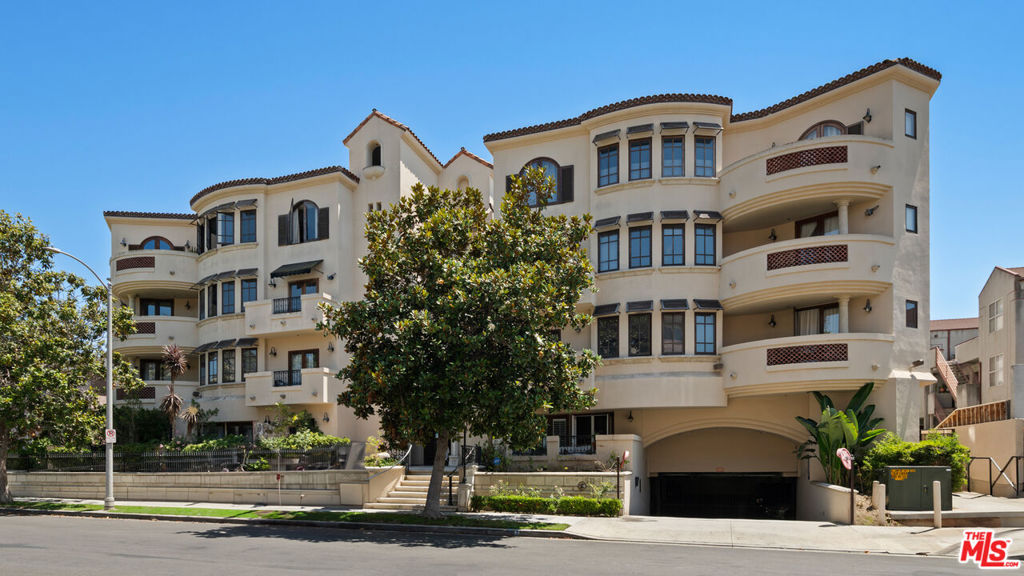 This beautifully appointed 2 bedroom, 2 bath, 1,569 sq. ft. condo sits on a quiet, tree lined street in one of West LA's most coveted neighborhoods. Recently remodeled, it blends the comfort of a 5 star hotel with the convenience of being just moments from Westwood Village and Century City.Set within a secure, newer-construction Mediterranean building, residents are welcomed through an elegant open-air courtyard with a charming fountain an immediate glimpse of the lifestyle within. Inside, a formal foyer opens to a spacious kitchen, family room, and living area designed for both everyday comfort and effortless entertaining. Two bedrooms are thoughtfully placed on opposite ends of the home, including a primary suite with abundant closet space, a spa-like bath with soaking tub, and direct access to the expansive covered patio. Every main room flows outdoors, creating a seamless indoor-outdoor experience perfect for morning coffee or evening gatherings.Rich hardwood floors, crown moldings, graceful arches, and beautifully restored tilework are enhanced by tall ceilings, natural light, and luxurious finishes.Residents enjoy a well-managed, secure community with gated underground parking (two tandem spaces plus guest parking). Whether savoring quiet mornings on your patio or stepping out to LA's premier shopping, dining, and cultural destinations, this home offers a lifestyle where every day feels elevated.