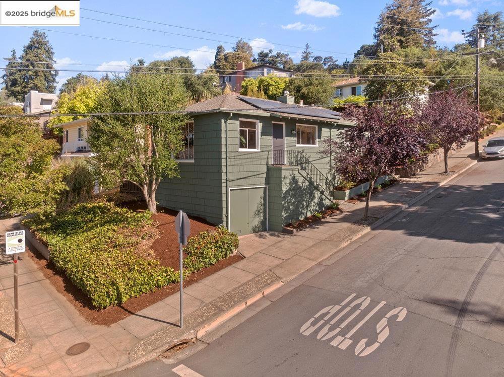 This Redwood Heights Gem is perched high and proud offering the perfect balance of seclusion, charm, and just enough connection to your neighbors. The home gets soaked in sunlight, making it feel like summer even on cloudy days. When you step inside, you’re greeted with hardwood floors and a giant picture window serves up a side of filtered views and natural light. The living and dining room flow into the kitchen, whether you’re prepping tacos or hosting a dinner party, the spacious kitchen has got your back. Two bedrooms are set apart from one another at either end of the hallway with the bathroom conveniently located in between. Off the kitchen, a separate laundry room provides added storage and access to the backyard—a true highlight of the property. Step outside to find thoughtfully laid out multiple zones for chilling, grilling, and gardening. The patio’s prime for evening meals with a side of sunset views, while the deck and lawn give you all the peace and quiet you need to decompress, kick back and watch the sky do its magic every evening! All this and you ARE in Redwood Heights—one of Oakland’s most sought-after and community-oriented neighborhoods: close to parks, shopping, restaurants, easy commuter access, and Redwood Heights Elementary (9/10 on greatschools.org)!