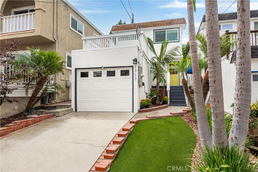 Experience coastal charm and modern comfort in this beautifully updated 3-bed, 2-bath single-family home, ideally situated on a quiet one-way street in Golden Hills. A sun-filled front deck offers the perfect spot to enjoy morning coffee or evening ocean breezes, while a classic Dutch door sets a warm, welcoming tone. Inside, light-filled spaces are enhanced by refinished hardwood floors, recessed lighting, and an open-concept living level. The remodeled kitchen is a true centerpiece, featuring a 9-foot island with bar seating, a wine fridge, Quartz countertops, stainless steel appliances, and a farmhouse Kohler sink—perfect for both entertaining and casual meals. Expansive Windor bi-fold doors open to a newly built TimberTech deck with gas and electrical hookups, overhead string lights, and plenty of room for dining or lounging, creating a seamless indoor-outdoor flow for everyday living or hosting. Upstairs, find all three bedrooms and a full bath, plus a sunlit landing ideal for a home office or reading nook. The office space features a newly installed Milgard window for added light and comfort. Each bedroom includes custom built-in closets for organized storage. The recently updated upstairs bath showcases fresh tile, vanity, and lighting, while the downstairs bath offers subway tile walls and patterned cement tile floors for a timeless touch. A detached, finished garage with drywall, recessed lighting, and insulation offers flexible use—whether as a home gym, creative studio, or hangout space—expanding your options for work and play. Thoughtful upgrades include fresh exterior paint, a tankless water heater, new HVAC system, abundant storage, and a conveniently located washer/dryer near the kitchen. Just over a mile from the beach and moments from award-winning Redondo Beach schools, shops, and dining, this home blends modern updates with the quintessential South Bay lifestyle. When you buy here, you're buying a lifestyle!