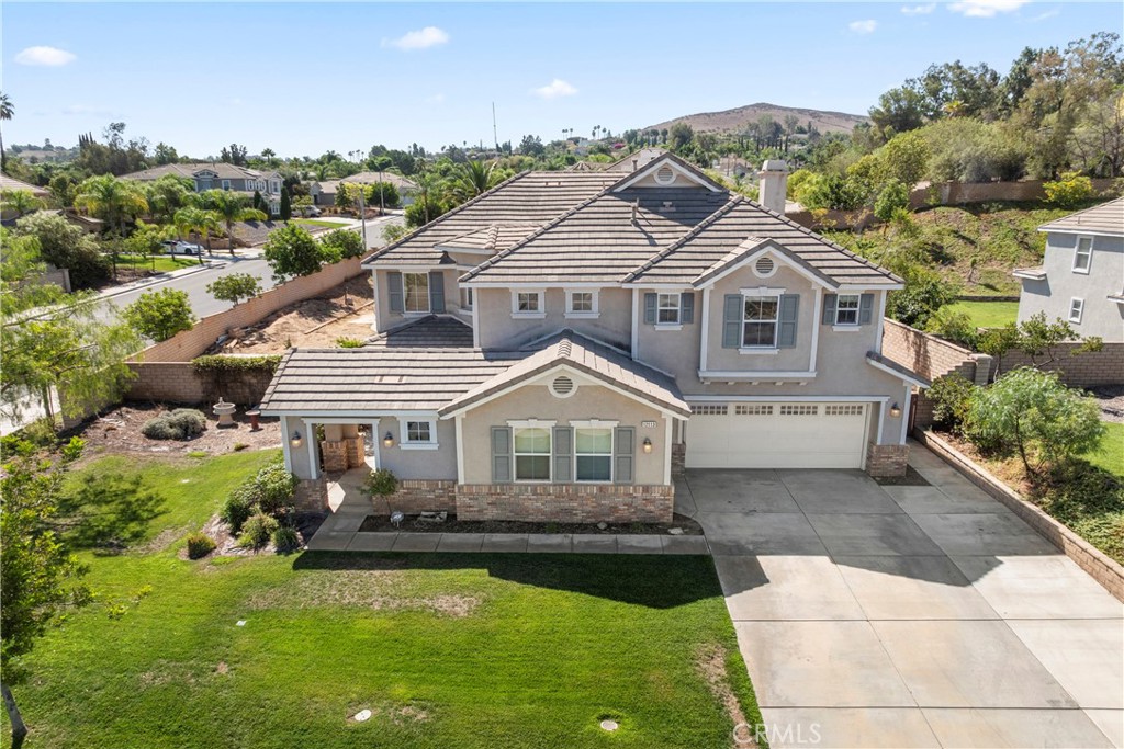 Welcome to 12113 Jonathan Dr, Riverside, CA 92503.
Situated on a spacious 19,166 sq. ft. lot, this stunning two-story home offers 3,794 sq. ft. of living space with 4 bedrooms and 3 bathrooms. Built in 2009, the property combines seamless flow with timeless comfort.
Step inside to a bright and open floor plan, perfect for both everyday living and entertaining. The large kitchen opens into the family room, creating a central hub for gatherings. Upstairs, you’ll find generously sized bedrooms and a luxurious primary suite complete with a spa-like bathroom and large balcony to welcome the day or wind down at sunset.
The expansive backyard, one of the largest in the neighborhood, provides endless possibilities—plenty of room for a pool, outdoor kitchen, or your dream garden. With its corner lot location, you’ll also enjoy added privacy and views of the surrounding hills.
Additional features include a main-floor bedroom, 3-car garage, energy-efficient windows, and a welcoming curb appeal. Nestled in the desirable Lake Hills - Victoria neighborhood of Riverside, this home offers the perfect blend of space, style, and convenience.
