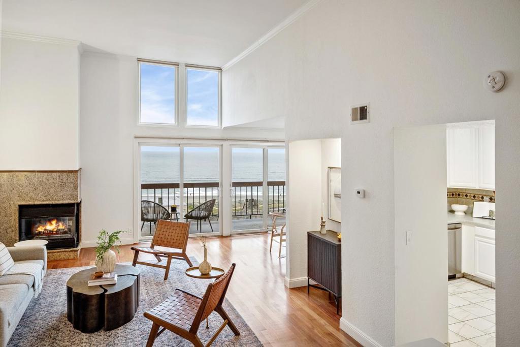 Here is your chance to own a coastal investment: a 2-bedroom, 2-bathroom condo with 1,260 square feet of breezy living and panoramic ocean views. Whether you're looking for a low-maintenance primary home or a high-appeal rental property, this one checks the boxes. Enjoy your morning coffee or evening wine from the private balcony with front-row seats to the Pacific. Inside, light-filled living and dining areas flow into a spacious kitchen and generous bedrooms, including a primary suite with direct access to a second private patio. An oversized 2-car garage gives you bonus storage for gear or rental flexibility. With HOA-covered exterior upkeep, this is ideal for anyone wanting a turnkey lifestyle with minimal hassle. And the location? Close to Linda Mar Beach, shopping, and more. Invest smart, live easy, and enjoy the coast year-round.