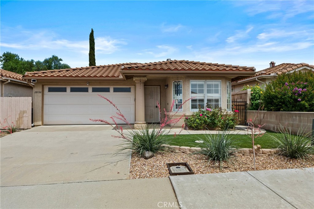 Look 55+ senior community. Beautiful Updated 2 bedroom 2 bath, with new barn door closure on main bath for privacy. Perfect for Relaxed Living. Designed with comfort, convenience, and easy living in mind. The heart of the home is the fully remodeled kitchen, featuring stainless steel appliances, Newer Washer & Dryer, which are all included, custom cabinetry, a 5 burner stove with double oven, backsplash dishwasher, Microwave, Refrigerator and a ceiling fan with energy-efficient LED lighting-idea for preparing meals and entertaining with ease. Enjoy the beauty of wood plantation shutters and low maintenance laminate flooring throughout, build in wood shelf in Garage, offering both style and practicality. Champagne front loading washer with dryer. The spacious master suite includes a walk-in closet and a ceiling fan for year-round comfort, with quite attic fan, for enhanced airflow. Step outside through elegant French doors into a peaceful, private backyard complete with artificial grass and a drought-tolerant landscaping-perfect-for relaxing without the upkeep. The front yard offers the same low-maintenance appeal, making it easy to enjoy your time instead of spending it on yard work. Additional features include a dedicated water purification system with a separate reverse osmosis dispenser-ensuring fresh, clean drinking water every day build in wood storage in garage. If you looking for a home that supports a more relaxed pace of life, this move-in-ready gem offers comfort, style, and a peace of mind. The Association common area features a swimming pool, club house, pickle ball court, BBQ area, gym and game room with stage.