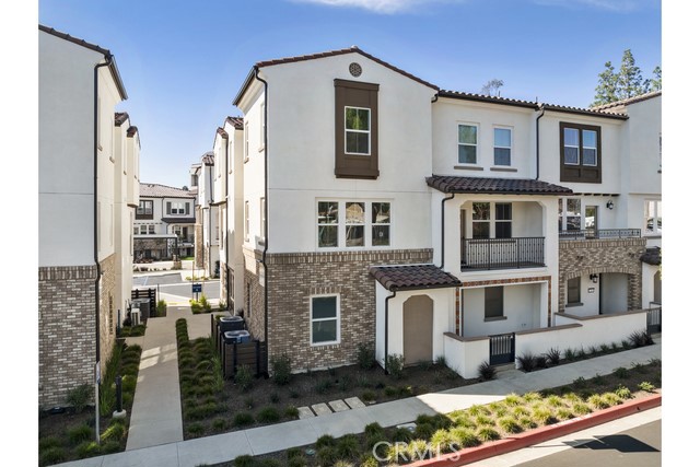 Modern Townhome Living with Views of Friendly Hills! Experience elevated living in this beautifully designed three-story, 3-bedroom, 3.5-bath new construction townhome, ideally located near shopping, dining, and entertainment hotspots like Amazon Fresh, Trader Joe’s, and HomeGoods. The ground level features a private bedroom and full bathroom, perfect for a guest suite, home office, or flex space. Upstairs, the spacious second floor showcases an open-concept layout with a large kitchen, dining area, and living room that offers scenic views of Friendly Hills—perfect for entertaining or relaxing. On the third floor, you'll find two generously sized en-suite bedrooms along with a convenient laundry room. Thoughtfully finished with a designer-curated package, this home includes luxury vinyl plank flooring, stainless steel appliances, and energy-efficient systems, including a leased solar power setup. A side-by-side two-car garage with extra storage completes the home’s impressive functionality and convenience.
With modern style, smart design, and a location that puts everything within reach, this townhome is the perfect blend of comfort and convenience.. Plus, take advantage of an exclusive builder incentive to help buy down your interest rate, making this stunning property even more accessible. Residents enjoy amenities including a BBQ picnic area and dog park, all in a walkable neighborhood with top-rated schools, vibrant retail, dining, and entertainment options. Nestled near Friendly Hills and close to major job centers in both Los Angeles and Orange County, Centro offers a perfect blend of convenience and community.