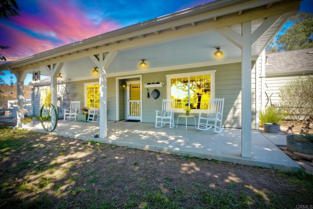 North San Diego County Charmer on 1.72 Acres! Welcome to the country lifestyle you’ve been dreaming of—right here in North San Diego! Arrive through your newly paved driveway and be greeted by a classic white picket fence, a welcoming front porch with rocking chairs, and a grassy yard shaded by mature mulberry trees (complete with a tire swing). This idyllic property is filled with mature fruit and avocado trees, a chicken coop, raised garden beds, and even a two-story playhouse that kids will love. With 1.72 usable acres, there’s room for a pool, ADU, horses, goats, and more—making this property as versatile as it is charming. The single-story, move-in-ready home offers 3 bedrooms, 2 baths, and 1,666 sq. ft. of comfort and functionality, and an attached 2-car garage. Recent upgrades include a new roof and front porch (2020), dual-pane windows (2019), gutters (2020), and a freshly paved driveway (2019). Central A/C keeps you cool year-round, and the charming fireplace is cozy on the cooler winter nights. Buy with confidence—title report, home inspection, and termite clearance are available for review. Located in the sought-after Bonsall School District, this property combines peaceful country living with convenient access to East Vista Way, connecting you quickly to Hwy 76, 78, I-5, and I-15. Beaches, golf, wineries, restaurants, tennis and pickleball clubs, and even the renowned Moonlight Amphitheater are all just a short drive away. With no HOA and no Mello Roos, you’ll enjoy the freedom to truly make this property your own.
