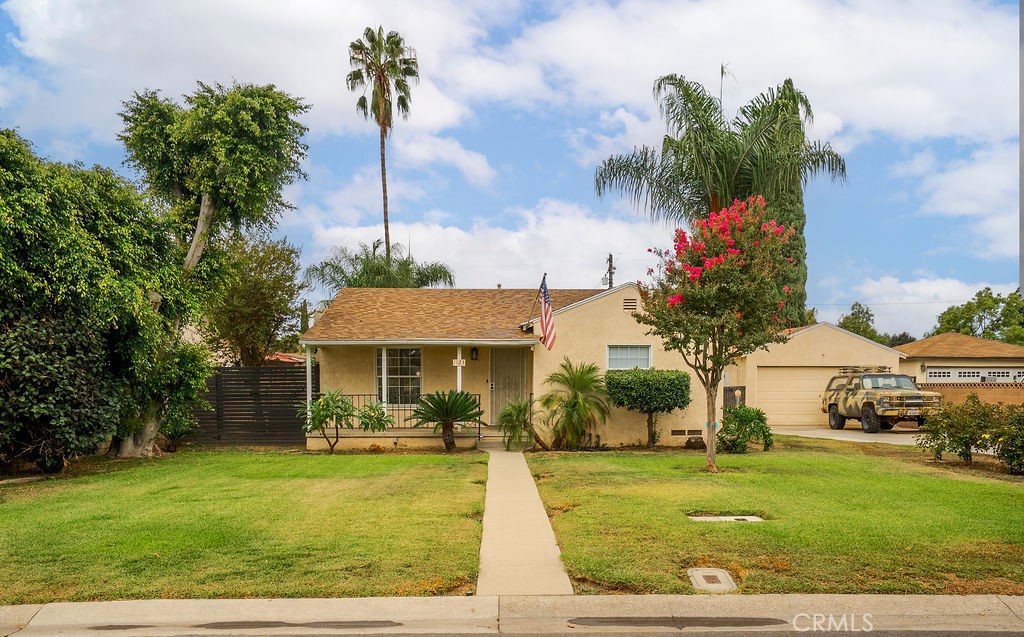 This charming little fixer is full of potential and ready for the perfect family to make it their own! Featuring 2 bedrooms, 1 bathroom, and 815 sq. ft. of living space, the home includes central air conditioning, a two-car detached garage, and ample parking. Situated on an expansive 15,577 sq. ft. flat lot, the possibilities are endless—build an ADU, add a swimming pool, create RV parking, or design the backyard of your dreams. A rare opportunity with so much space to customize to your lifestyle! Don’t miss this chance to own a home with so much room to grow!