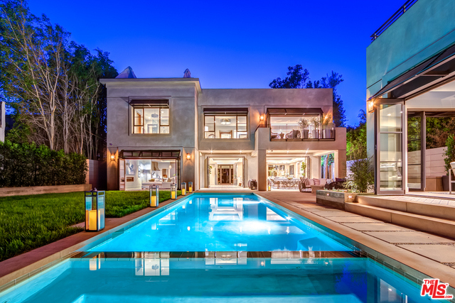 Villa Orlando - Where Luxury and Location Converge: A rare & exquisite urban estate is now available on coveted North Orlando Avenue. No West Hollywood/Los Angeles home in the flats of this caliber has ever come on the market! The grand main floor rooms open to a spectacular back yard with a 675 sqft swimming pool, a deluxe BBQ area & a 2-story detached casita on the 12000+ sqft lot. The chef's kitchen, outfitted with Miele appliances, looks onto the family, dining & living spaces. An expansive natural limestone fireplace & beautifully appointed wine bar lead one to envision elegant parties. The ground floor guest bedroom with adjoining bathroom can easily double as a bright home office. The 1750 square foot master suite features a balcony and separate his & hers walk-in closets. The master bathroom boasts its impressive double shower & deep soaking tub. One floor higher is an open roof deck.