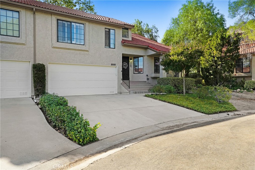 Welcome Home to Scenic Hills, a Beautiful Gated Community!! Spacious 2 bed+2 bath, tri-level (townhouse style) condo. Cul-de-sac end unit location with no neighbors behind. Home offers wood flooring, vinyl flooring, upgraded window shutters and ceiling fans throughout. Light and bright open living room with vaulted ceilings. Formal dining room. Separate family room featuring a cozy fireplace leads out to a private patio area. Kitchen features a garden window, breakfast bar eating area and granite countertops. Oversized primary bedroom features a ceiling fan, large walk-in closet, double sink vanity area with granite countertops and a separate walk-in shower area. Home has a good size attached two car garage with direct access. Laundry is located in garage. Community offers an array of resort-style amenities such as gated entrance, nine hole golf course, tennis courts, basketball court, swimming pool, indoor spa, sauna, work out room, picnic area, clubhouse and more. MUST SEE!!!!