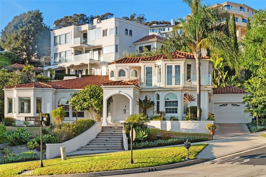 Nestled within the exclusive guard-gated enclave of Sea Pointe Estates in San Clemente, this private custom residence offers a rare blend of timeless Mediterranean design, versatile living spaces, and breathtaking coastal vistas.

The expansive open-concept floor plan showcases 4 bedrooms and 3.5 baths, including two primary suites thoughtfully designed for comfort and flexibility—one conveniently located on the main floor and another upstairs capturing sweeping ocean, Catalina Island, Dana Point Harbor, and sunset views. Two additional bedrooms on the main level provide comfort for family or guests.

Upon entry, soaring ceilings and an abundance of natural light set the stage for seamless indoor-outdoor living. The formal living and dining areas flow effortlessly together, creating an inviting atmosphere for gatherings. A generously sized family room and chef-inspired kitchen, complete with panoramic window views, make everyday living feel extraordinary.

The upstairs primary suite is a private retreat featuring an oversized layout, dual-sided fireplace, luxurious soaking tub, and a view deck perfect for enjoying San Clemente’s stunning sunsets. Outdoors, a Mediterranean-style façade frames ocean views, while a shaded fountain patio sets the tone for dining al fresco. A spacious entertaining casita with kitchenette, bath, and shower offers additional versatility for hosting or extended stays.

A three-car garage provides ample space for the car enthusiast. Residents of Sea Pointe Estates enjoy resort-style amenities including a pool and spa, tennis courts, clubhouse, and fitness center—all within moments of world-class beaches, the San Clemente Pier, charming boutiques, wine bars, and coastal dining.