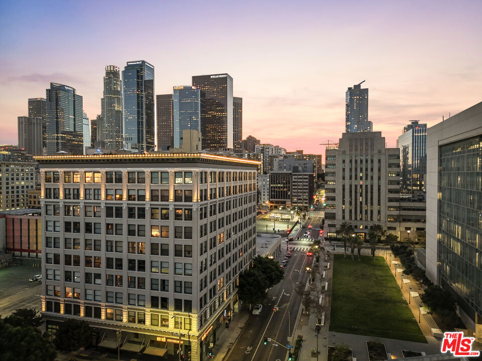 New York style Two-story penthouse unit with views and private roof deck in the historic Higgins door man building. Offers a rare opportunity to own a truly unique private residence in the heart of downtown Los Angeles. Designed with soaring high ceilings, Eastern views and a live/work loft-style layout, the space blends dramatic architecture with flexibility and character. Boasting breathtaking panoramic views including direct exposure overlooking the beautiful Saint Vibiana Cathedral. The home features a large private rooftop deck (accessible through the unit) perfect for entertaining or relaxing with panoramic city views. Inside, you will find a striking mix of Art Deco design and aviation-inspired details that make this residence truly one of a kind. The unit is located in the Higgins Building which has been designated as a Historic-Cultural Monument and is covered under the Mills Act. Perfectly situated close to Grand Central Market, fine dining, entertainment, museums, concert halls, and subway station. This is more than a home. It's a lifestyle rooted in history, design, and vibrant urban living.