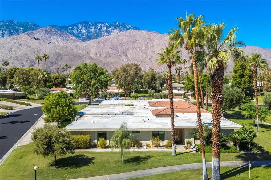 A true oasis in the desert! Back in the days when Bing Crosby & Frank Sinatra were in the area, rumored to be hanging out at the Purple Room just up the street... Sunrise East was created as 130 modern styled homes on a sprawling 44 acres, with six pools and spas for relaxing your way! Yes, six rather private pool & spa enclosures, or for the more active types, check out the grand tennis courts (now with pickle ball too). Sunrise East has worked hard over the years to strike a balance of greenbelts with lush hedges and old-growth trees, while also working to reduce it's water footprint, and the result is simple gorgeous! Come explore the well lit sidewalks & trails within the serine park like settings of this true oasis! Now this 3Br/2Ba is an end unit condo on an elevated lot within the center, southwest quadrant, quiet yet in the center of it all. This home embodies the floor-to-ceiling panes of glass and open floor plan that were the hallmarks of midcentury homes, complete with the tropical plant-lined atrium! Lots of windows to let the sun shine in, bright and open, or of course the custom shades too for when you desire a little privacy. Key features are the large great room with recessed lighting, stone fireplace, and even an entertainment bar ...plus the three large bedrooms, rather large baths, with the third bedroom offering flexibility as an office/den and guest room (murphy bed included). Huge custom closets in each room, and ample storage throughout. The entire home has been remodeled, with grey wood-grain porcelain tile running throughout the home, plus black quartz or multi-colored granite countertops, and unique silver cabinetry too. And of course, all the structural upgrades you would expect, with all dual-pane windows & doors, dual AC systems (mini-splits added for master suite & attached garage), whole-house water filtration system, and a host of other goodies. All new roof installed late 2021. And did we mention that this home is being offered 'turnkey furnished' at no additional cost?! Bring a change of clothing and a toothbrush, then just settle right in :). Whether you are relaxing on the back patio with friends, or privately enjoying that screened atrium, you are going to love all of the options you have right here. EASY TO SHOW, COME SEE US TODAY!!