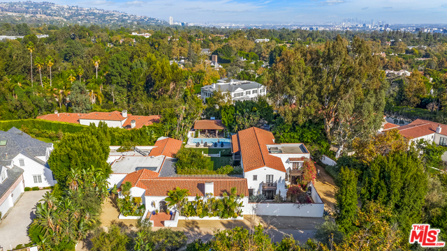 WALLACE NEFF & JOHN BYERS, 1928, "El Mirasol." Built by two of the most prolific architects of the 20th century, the prestigious East Gate estate, features this 7 bed, 9 bath gated Spanish home that sits on almost 1 FLAT ACRE. Featured in Architectural Digest while home to Diane Keaton, this property has been home to everyone from Orson Welles, Peter Bogdanovich, & Richard Brooks. Reimagined by famed decorator Madeline Stuart, this iconic home is perfect for enjoying the California lifestyle. While designed on a grand scale, the formal rooms remain intimate. The dramatic living room features vaulted ceilings & steel doors that open to sprawling grounds. The left wing of the house features a screening room, chauffeurs quarters & chef's kitchen, opening to the breakfast room & family room.The right wing hosts the library, large bonus room/studio & master suite.One of the most perfect examples of 1920s Spanish architecture with the charm of yesterday and the conveniences of tomorrow.
