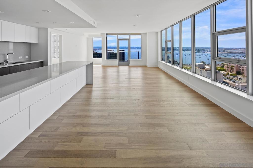 Welcome to Unit 1502 at Savina by Bosa, one of Downtown San Diego’s premier luxury residences. This further elevated northwest corner unit offers sweeping, unobstructed bay views and unmatched living space. Enjoy refined urban living with designer finishes, wood flooring throughout, and a well-designed layout featuring 2 spacious bedrooms, 2 bathrooms, a versatile den/home office, and a large sky patio perfect for entertaining or relaxing. The split-bedroom layout ensures privacy and functionality, while the two side-by-side parking spaces add convenience. Perfectly positioned between the Harborfront and Little Italy, Savina 1502 offers sophisticated luxury living in a vibrant, walkable location. Experience the best bay view in America's Finest City. Savina 1502 was featured as big bay's "DREAM PLACE to be" in America's Finest City. This 2 bed 2 bath plus den/home office northwest facing corner unit, offers families and individuals a rare opportunity to live in San Diego's latest luxury building, in the most vibrant community, with magnificent water view. Don't miss this one. A collection of over 24,000 square feet of indoor-outdoor amenities extends your living space. Resort inspired pool terrace, a spa-like sauna and steam room and a social resident lounge, pet retreat, bike storage. Ground level accesses to retailers. Walk to city's best restaurants, coffee shops, waterfront park and outdoor venues. 5 mins drive to San Diego International Airport. 15 mins drive to UCSD.