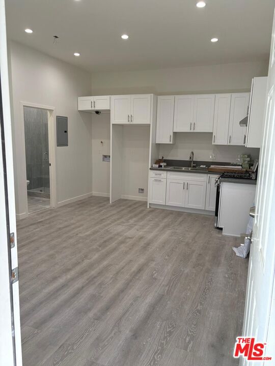 This newly built single unit is now available for rent in the heart of North Hollywood. The home features a modern open floor plan with new flooring, recessed lighting, and a private entrance for added convenience and privacy. The kitchen is equipped with updated cabinetry, ample storage space, and laundry hookups for in-unit washer and dryer. The unit also includes a comfortable living area, a walk-in closet, and a sleek bathroom with contemporary finishes. Utilities are paid by the tenant.