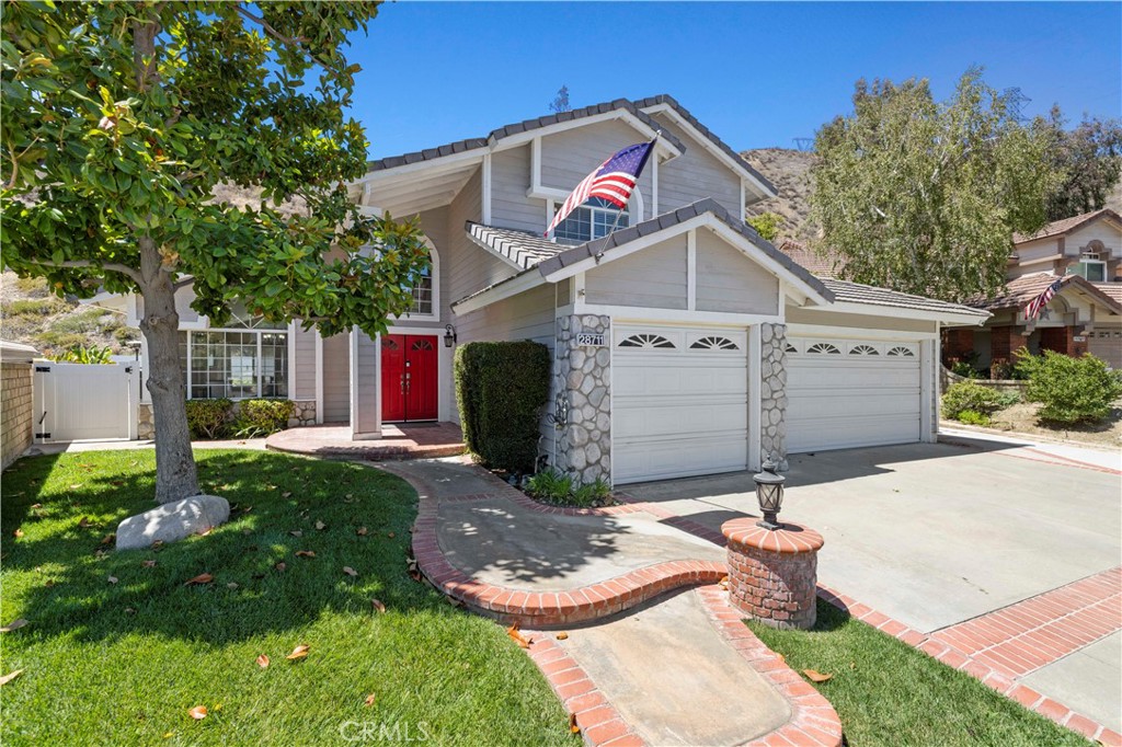 BLINK AND YOU’LL MISS IT! Don’t wait to claim your slice of poolside paradise at this gorgeous, updated Saugus home with OWNED solar, a resort-style backyard, and NO rear neighbors! This stunning 4-bedroom, 3-bath home shines inside and out. Step inside to find newer wood-look tile floors on the main level, abundant natural light, plantation shutters, PLUS a spacious downstairs bedroom with access to a full bath—perfect for guests, multi-gen living, or a home office. The updated kitchen boasts crisp white cabinetry, a center island with granite countertops, stainless steel appliances including double ovens, and a sunny breakfast nook. A cozy family room fireplace and charming laundry room add warmth and functionality. Upstairs, the primary suite offers a retreat/seating area with its own fireplace, blackout shades, walk-in closet, and an elegantly updated en-suite bath with frameless shower enclosure and stand alone soaking tub. Two additional bedrooms share a Jack-and-Jill bath, and a whole-house fan keeps the home cool year-round. The entertainer’s backyard is pure California dream living—featuring a 2021 Pebble Tec pool with baja shelf entry, umbrella holder, raised spa, waterslide, and a state-of-the-art iAquaLink WiFi system. Relax under the happy hour hut, gather around the firepit, or enjoy the privacy of vinyl fencing and NO rear neighbors! A spacious 3-car garage and extended driveway offer plenty of parking for vehicles and recreational toys. A true move-in ready gem loaded with upgrades that won’t last long!